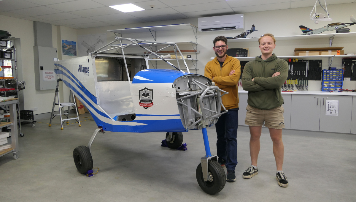 Aerospace students Baiden and Blair return to see the progress of the plane build